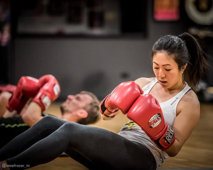 People exercising in a group boxing class at West End AC