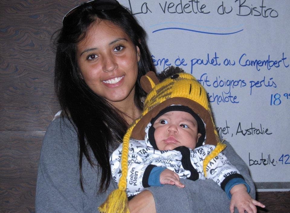 Lexi Perez holding her son as a baby.