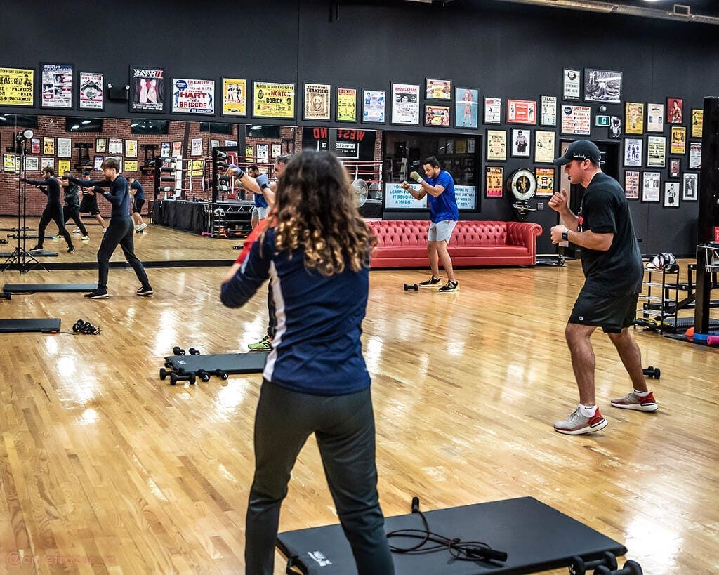 Group boxing and fitness class members enjoying their first time specials at West End AC in Toronto.