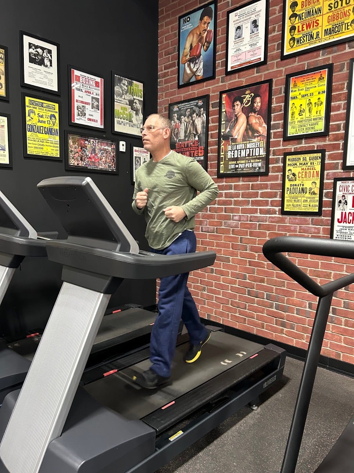 Michael Gossack walking on a treadmill inside the West End Athletic Club Boxing and Fitness Gym in Toronto.